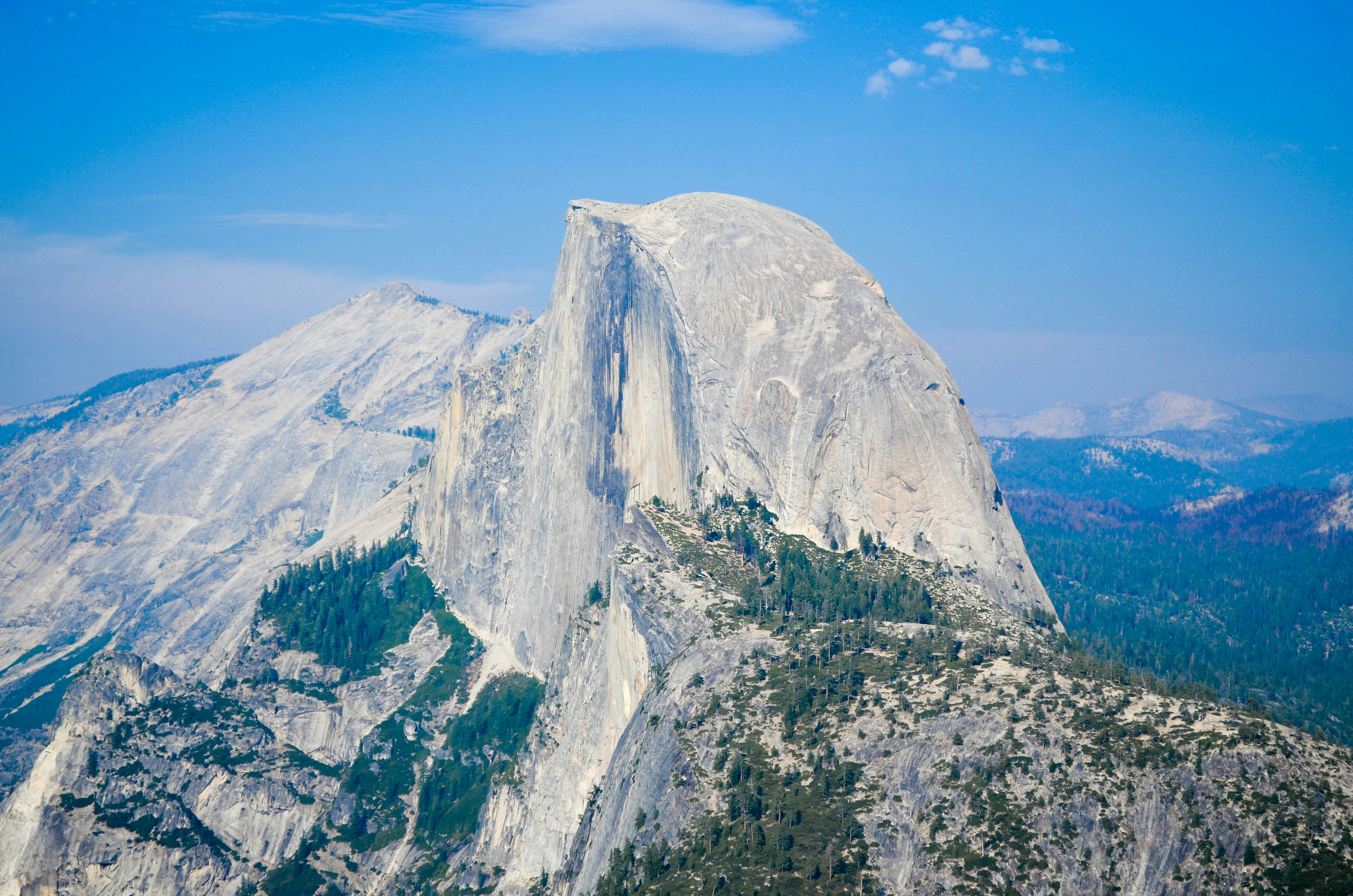 aerial view photography of mountain under cloudy sky